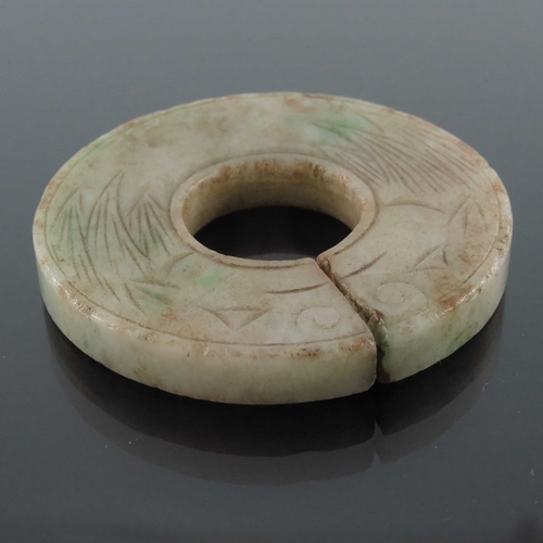 412 - Four Chinese carved jade pendants, some reticulated, including an incised ring medallion, figures an... 