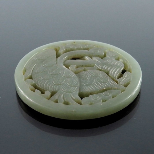 413 - Four Chinese reticulated carved jade pendants, including circular coiled dragon, goose and foliate s... 