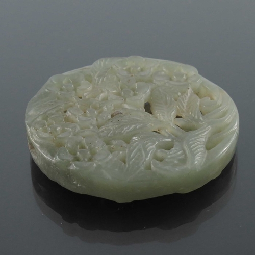 413 - Four Chinese reticulated carved jade pendants, including circular coiled dragon, goose and foliate s... 