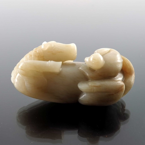 420 - A Chinese jade carving, in the form of a supine horse with monkey, 9cm