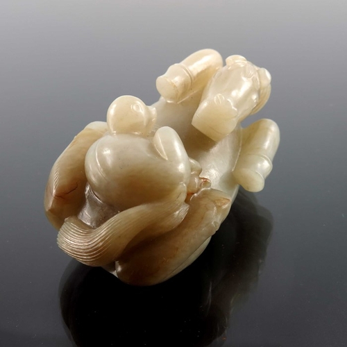 420 - A Chinese jade carving, in the form of a supine horse with monkey, 9cm