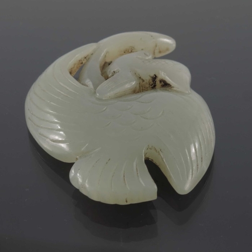 421 - Four Chinese reticulated jade pendants, including knotted serpents, dragon and birds, 7.5cm (4)