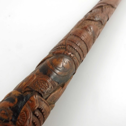 425 - A Japanese carved bamboo cane, Meiji, decorated in the round with battling Samurai, signed, 89cm lon... 