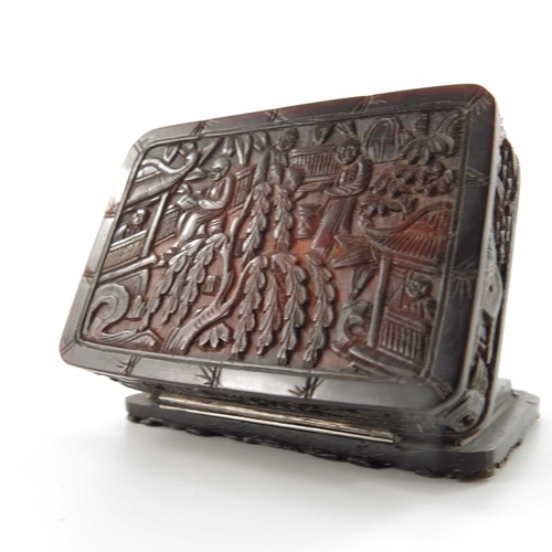 433 - A Chinese carved tortoiseshell snuff box, 19th century, modelled in relief with populated garden lan... 