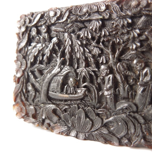 433 - A Chinese carved tortoiseshell snuff box, 19th century, modelled in relief with populated garden lan... 