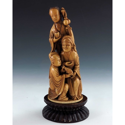 435a - ? A 19th century carved seated ivory figure, modelled as Buddha, together with a carved ivory figure... 