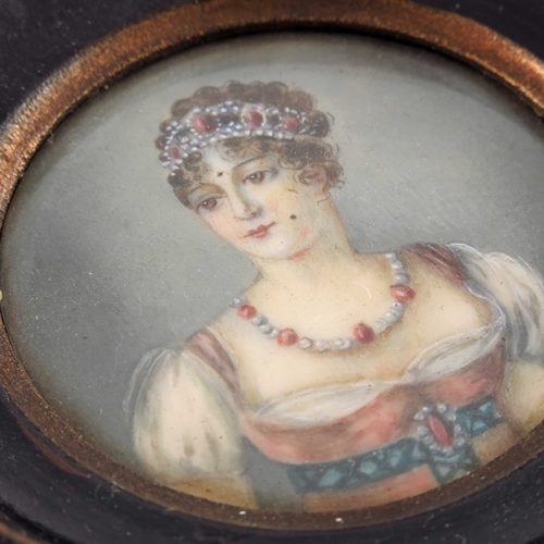 463 - A pair of 19th century French portrait miniatures, of aristocratic women, signed, 5cm diameter, fram... 