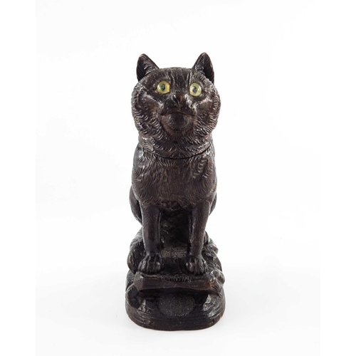 469 - A Black Forest carved wooden inkwell, 19th century, modelled as a cat, set with glass eyes, 18cm hig... 