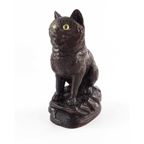 469 - A Black Forest carved wooden inkwell, 19th century, modelled as a cat, set with glass eyes, 18cm hig... 