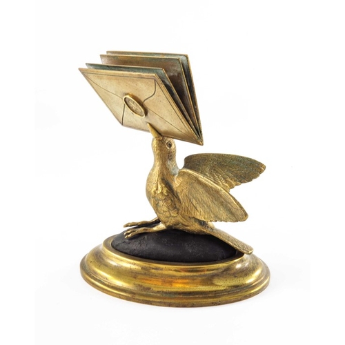 470 - A gilt brass figural letter holder, 19th century, modelled as a bird with beak full of letters, on a... 