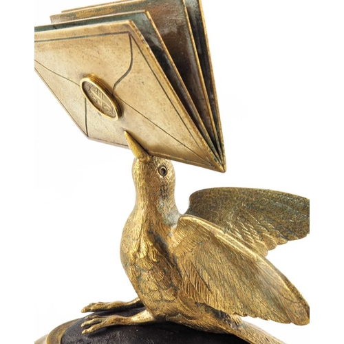 470 - A gilt brass figural letter holder, 19th century, modelled as a bird with beak full of letters, on a... 