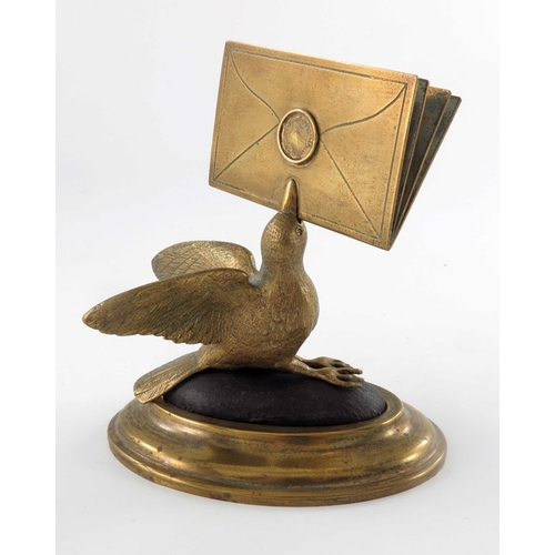 470 - A gilt brass figural letter holder, 19th century, modelled as a bird with beak full of letters, on a... 