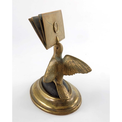 470 - A gilt brass figural letter holder, 19th century, modelled as a bird with beak full of letters, on a... 