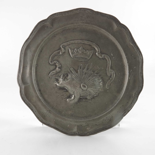 471 - Two pewter plates, 18th century style, embossed in relief with the porcupine and salamander emblems ... 