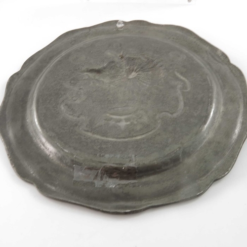 471 - Two pewter plates, 18th century style, embossed in relief with the porcupine and salamander emblems ... 