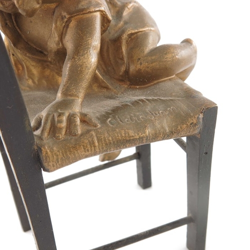 482 - Juan Clara (1857-1958), a bronze and gilt sculpture, modelled as a child climbing on a chair, signed... 