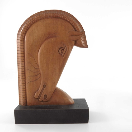 497 - A pair of Art Deco carved wooden bookends, in the style of Laszlo Hoenig, beech on ebonised bases, m... 