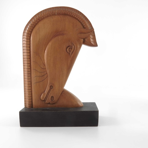 497 - A pair of Art Deco carved wooden bookends, in the style of Laszlo Hoenig, beech on ebonised bases, m... 