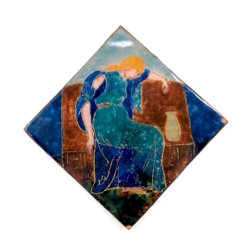 499 - An Arts and Crafts enamelled copper plaque, in the Pre Raphaelite style, depicting a seated woman wi... 