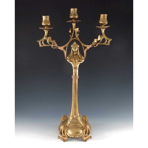 505 - A Jugendstil gilt metal three light candelabrum, Art Nouveau style, cast foliate and open tendril de... 