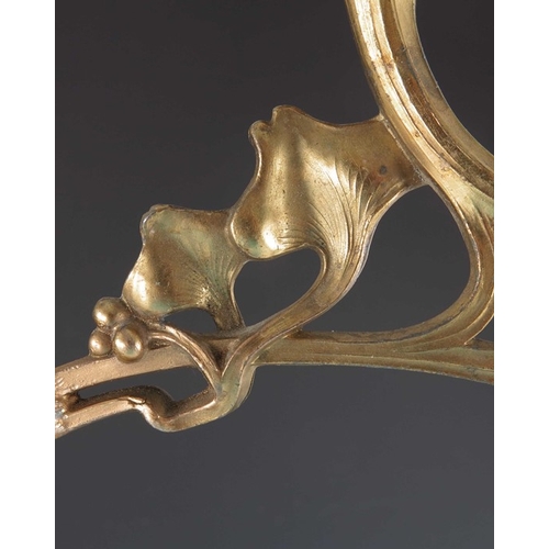 505 - A Jugendstil gilt metal three light candelabrum, Art Nouveau style, cast foliate and open tendril de... 