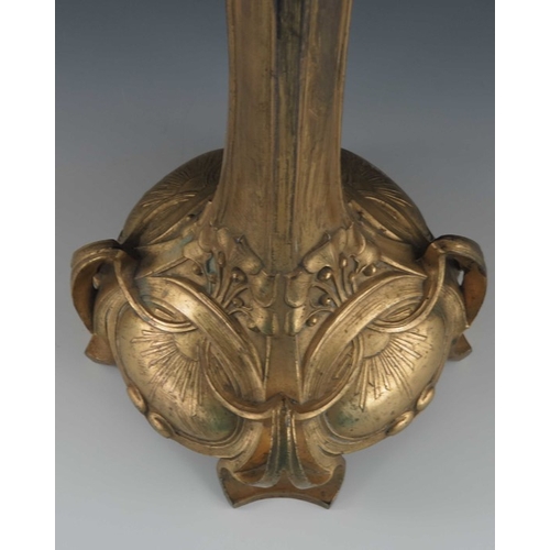 505 - A Jugendstil gilt metal three light candelabrum, Art Nouveau style, cast foliate and open tendril de... 