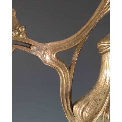 505 - A Jugendstil gilt metal three light candelabrum, Art Nouveau style, cast foliate and open tendril de... 