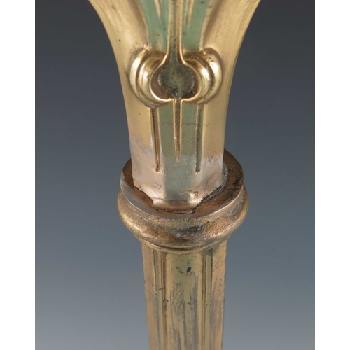 505 - A Jugendstil gilt metal three light candelabrum, Art Nouveau style, cast foliate and open tendril de... 