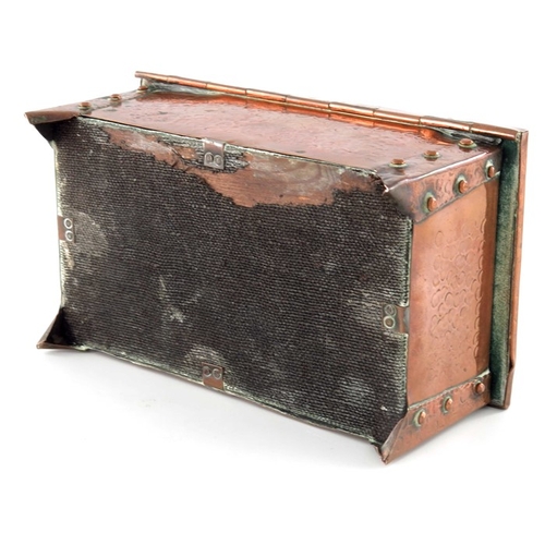 514 - An Arts and Crafts copper box, cuboid form, planished with riveted strap legs, 17.5cm wide, 8cm high... 