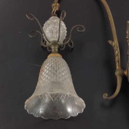 528 - A pair of Victorian gilt brass and cut glass wall lights, circa 1900, the hobnail cut shades with sp... 