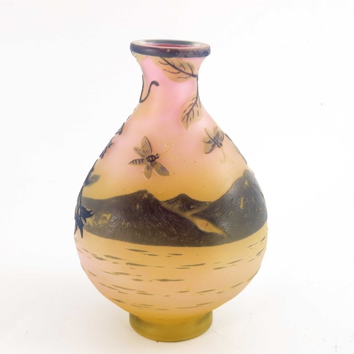 555 - Emile Galle, a cameo glass landscape vase, circa 1905, purple over yellow and pink, flattened balust... 