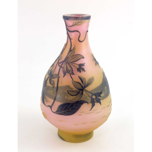 555 - Emile Galle, a cameo glass landscape vase, circa 1905, purple over yellow and pink, flattened balust... 