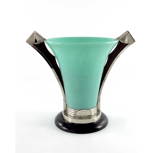 557 - An Art Deco moulded glass, chrome and macassar vase, circa 1930, the trumpet shaped leather textured... 