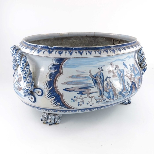 578 - A Delft probably French Nevers blue and white manganese cistern or wine cooler, of oval bombe form, ... 