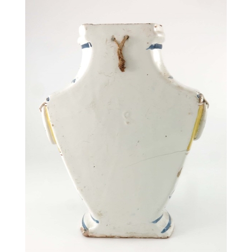 579 - A Continental faience wall hanging syphon, circa 1790, twin handled half urn form with metal tap, pa... 