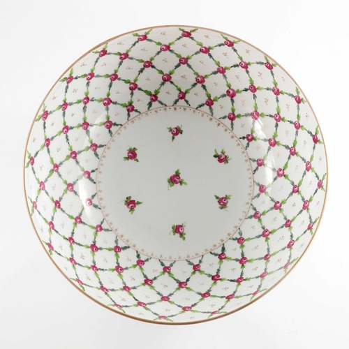 582 - A Paris porcelain punch bowl, in the Sevres style, painted with a diaper trellis pattern of rose hea... 