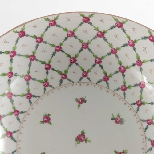 582 - A Paris porcelain punch bowl, in the Sevres style, painted with a diaper trellis pattern of rose hea... 