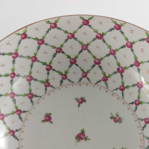 582 - A Paris porcelain punch bowl, in the Sevres style, painted with a diaper trellis pattern of rose hea... 