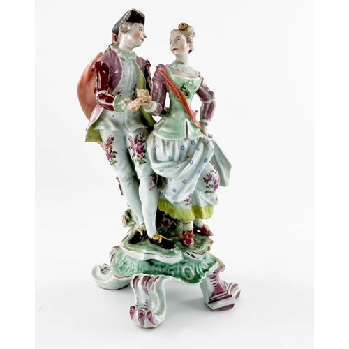 584 - A Continental porcelain figure group, 18th century, modelled as a courting couple, on scroll bracket... 