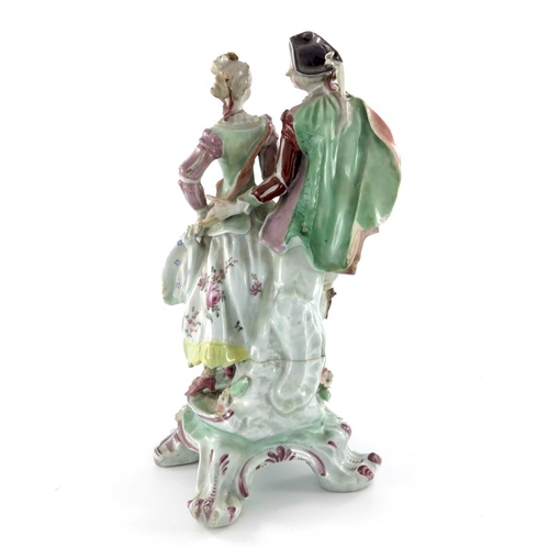 584 - A Continental porcelain figure group, 18th century, modelled as a courting couple, on scroll bracket... 