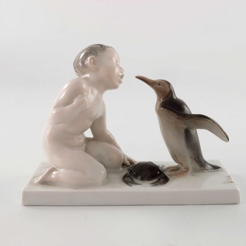 598 - Ferdinand Liebermann for Rosenthal, a figure group of boy, penguin and crab, model 34, designed circ... 