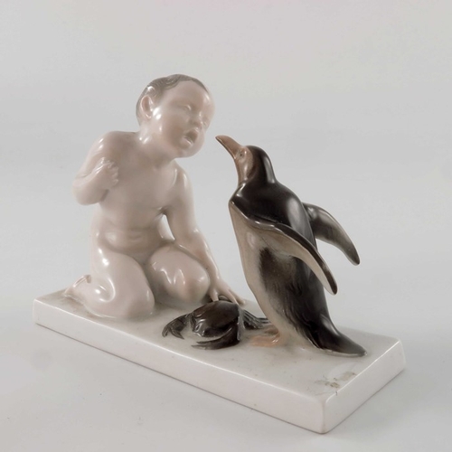 598 - Ferdinand Liebermann for Rosenthal, a figure group of boy, penguin and crab, model 34, designed circ... 