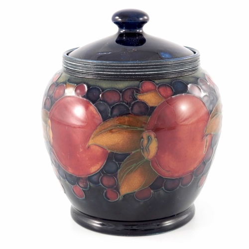 634 - William Moorcroft, a Pomegranate pot and cover, circa 1920, ovoid form, impressed marks and undergla... 