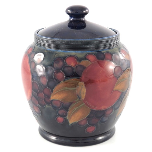 634 - William Moorcroft, a Pomegranate pot and cover, circa 1920, ovoid form, impressed marks and undergla... 