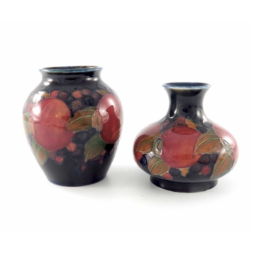 636 - William Moorcroft, two small Pomegranate vases, circa 1918, shouldered and squat baluster forms, imp... 