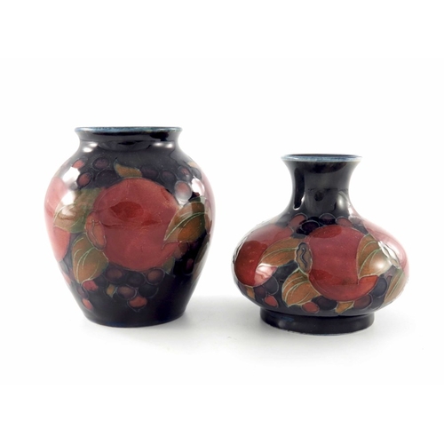 636 - William Moorcroft, two small Pomegranate vases, circa 1918, shouldered and squat baluster forms, imp... 