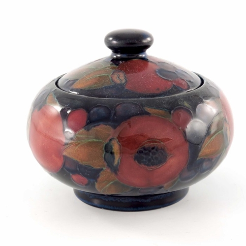 638 - William Moorcroft, a Pomegranate jar and cover, circa 1920, ovoid form, impressed marks and undergla... 