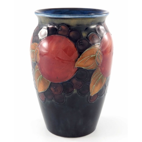 642 - William Moorcroft, a Pomegranate on ochre and blue vase, circa 1920, shouldered form, impressed mark... 