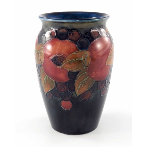 642 - William Moorcroft, a Pomegranate on ochre and blue vase, circa 1920, shouldered form, impressed mark... 