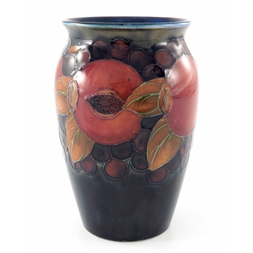 642 - William Moorcroft, a Pomegranate on ochre and blue vase, circa 1920, shouldered form, impressed mark... 